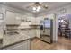 Well-lit kitchen with granite countertops and stainless steel appliances at 5327 Saville Nw Dr, Acworth, GA 30101