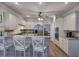 Open kitchen with breakfast bar, stainless appliances, and a seamless transition to other living spaces at 5327 Saville Nw Dr, Acworth, GA 30101