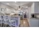 Charming kitchen features white cabinets, granite countertops, stainless steel appliances, and hardwood flooring at 5327 Saville Nw Dr, Acworth, GA 30101