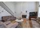 Cozy living room with hardwood floors, a fireplace, and comfortable seating, creating a warm and inviting atmosphere at 5327 Saville Nw Dr, Acworth, GA 30101