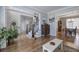 Open-concept living room with wood floors and easy access to the dining area and foyer at 5327 Saville Nw Dr, Acworth, GA 30101