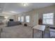 Spacious living room with neutral carpet, bright windows, and comfortable seating at 5327 Saville Nw Dr, Acworth, GA 30101