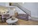 Inviting living room with hardwood floors, comfortable seating, and a staircase leading to the second floor at 5327 Saville Nw Dr, Acworth, GA 30101