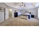 Serene main bedroom with a tray ceiling, carpeted floors, and ample space, creating a peaceful and relaxing retreat at 5327 Saville Nw Dr, Acworth, GA 30101