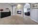 Spacious main bedroom featuring a tiled fireplace and archway to other rooms at 5327 Saville Nw Dr, Acworth, GA 30101