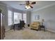 Comfortable office with plush carpet, chair railing, and a bay window at 5327 Saville Nw Dr, Acworth, GA 30101