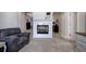 Sitting area with a tiled fireplace and views into multiple rooms at 5327 Saville Nw Dr, Acworth, GA 30101