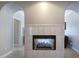 Sitting area with a tiled fireplace and archways to multiple rooms at 5327 Saville Nw Dr, Acworth, GA 30101