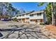 Charming townhome community featuring brick accents, white siding, and convenient parking in a well-maintained neighborhood at 6035 Wintergreen Rd, Norcross, GA 30093