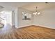 Open-concept living space with hardwood floors and a pass-through to the kitchen at 6035 Wintergreen Rd, Norcross, GA 30093