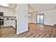 Open kitchen and dining area featuring hardwood floors, sleek appliances, and access to the outdoor space at 6035 Wintergreen Rd, Norcross, GA 30093