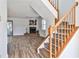 Inviting view of the staircase, hardwood floors, and a cozy fireplace in the living room at 6035 Wintergreen Rd, Norcross, GA 30093