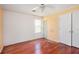 Bedroom featuring wood floors, a ceiling fan, and a closet at 1377 Ling Dr, Austell, GA 30168