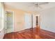 Spacious bedroom featuring wood floors, a ceiling fan, and access to an en-suite bathroom at 1377 Ling Dr, Austell, GA 30168