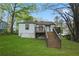 View of the backyard with a wooden deck and stairs leading to the yard at 2132 Penrose Dr, East Point, GA 30344