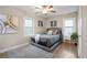 Cozy bedroom with hardwood floors, ample natural light from two windows, and tasteful decorations at 2132 Penrose Dr, East Point, GA 30344
