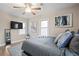 Bright bedroom features a large window, a bed with a stylish headboard, and modern decor at 2132 Penrose Dr, East Point, GA 30344