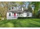 Charming single story home with a red front door and inviting curb appeal at 2132 Penrose Dr, East Point, GA 30344