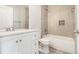 Modern bathroom featuring a vanity, toilet, and tiled shower/tub combination, offering both style and functionality at 3525 Parc Sw Cir, Atlanta, GA 30311