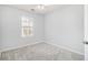 Bright bedroom showcasing a window with natural light and soft carpeting, perfect for relaxation and comfort at 3525 Parc Sw Cir, Atlanta, GA 30311