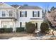 Charming two-story townhome with gray siding and black shutters, complemented by manicured landscaping and a well-maintained lawn at 3525 Parc Sw Cir, Atlanta, GA 30311