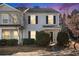 Charming two-story townhome with gray siding and black shutters, complemented by manicured landscaping and a well-maintained lawn at 3525 Parc Sw Cir, Atlanta, GA 30311