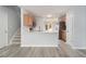 Bright kitchen features a breakfast bar, stainless steel appliances, and light countertops, complemented by modern gray flooring at 3525 Parc Sw Cir, Atlanta, GA 30311