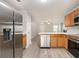 Modern kitchen with stainless steel appliances and wood cabinets showcases a functional and stylish space at 3525 Parc Sw Cir, Atlanta, GA 30311