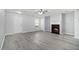 Inviting living room features gray walls, a fireplace, and modern gray laminate flooring, creating a cozy and open space at 3525 Parc Sw Cir, Atlanta, GA 30311
