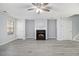 Bright living room features gray walls, a fireplace, and modern gray laminate flooring, creating a cozy and inviting space at 3525 Parc Sw Cir, Atlanta, GA 30311