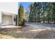 Side yard with lush greenery and well-manicured lawn, offering ample space for outdoor activities and enjoyment at 3525 Parc Sw Cir, Atlanta, GA 30311