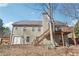 Back exterior view of a home with a deck, patio, and backyard at 509 Plantation Creek Dr, Loganville, GA 30052