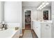 Modern primary bath featuring dual sinks, walk-in closet, and separate soaking tub at 509 Plantation Creek Dr, Loganville, GA 30052