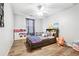 Cozy bedroom designed for a with wood floors and playful decorations at 509 Plantation Creek Dr, Loganville, GA 30052