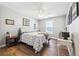 Comfortable bedroom with hardwood floors and a cozy atmosphere at 509 Plantation Creek Dr, Loganville, GA 30052