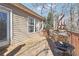 Outdoor deck featuring wood flooring and furniture, perfect for relaxing and entertaining at 509 Plantation Creek Dr, Loganville, GA 30052