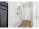 Bright entryway featuring wood floors and a decorative shelf at 509 Plantation Creek Dr, Loganville, GA 30052