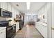 Bright kitchen featuring white cabinets and modern appliances, perfect for cooking at 509 Plantation Creek Dr, Loganville, GA 30052