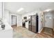 Charming kitchen featuring white cabinets, modern appliances, and stylish flooring at 509 Plantation Creek Dr, Loganville, GA 30052