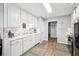 Bright kitchen with white cabinetry, modern countertops and stylish flooring at 509 Plantation Creek Dr, Loganville, GA 30052