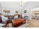Comfortable living room featuring hardwood floors and a vaulted ceiling at 509 Plantation Creek Dr, Loganville, GA 30052