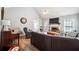 Cozy living room with a brick fireplace, vaulted ceiling, and hardwood floors at 509 Plantation Creek Dr, Loganville, GA 30052