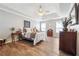 Serene bedroom with hardwood floors and a decorative tray ceiling at 509 Plantation Creek Dr, Loganville, GA 30052