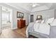 Bright bedroom featuring hardwood floors, trey ceilings and ensuite bath at 509 Plantation Creek Dr, Loganville, GA 30052