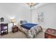 Neutral bedroom featuring a twin bed, ceiling fan, and a window with plantation shutters at 720 Nightwind Way, Stockbridge, GA 30281