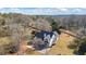 Aerial view of the home showcasing the backyard, surrounding foliage, and a storage shed at 3955 Pucketts Rd, Snellville, GA 30039