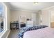 A bedroom featuring wood-look flooring, a white dresser and a well-lit vanity area at 3955 Pucketts Rd, Snellville, GA 30039