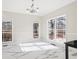 Sun-filled dining room featuring large windows, neutral paint, and elegant marble floors at 3955 Pucketts Rd, Snellville, GA 30039