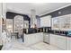 Stylish kitchen featuring modern appliances, black countertops and a breakfast bar with natural light at 3955 Pucketts Rd, Snellville, GA 30039