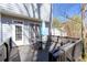 Inviting back deck featuring an outdoor dining set and umbrella, perfect for relaxing at 450 Congress Pkwy, Lawrenceville, GA 30044